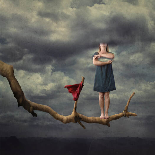 fine art photograph of female standing on a limb next to a red flag with an invisible chest and her head in the clouds